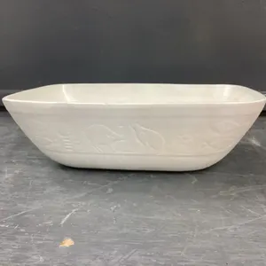 SUNBURST WHITE POTTERY  BOWL W/ SOME ENGRAVING AROUND THE EDGES