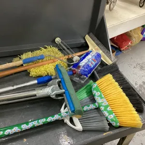 BOX OF BROOMS, MOPS, PAINT ROLLER, CARPET RAKE,