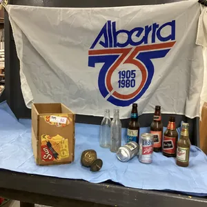 ALBERTA 75TH FLAG, ORANGE CRATE W/ VINTAGE BEER BOTTLES, COKE BOTTLE AND BRASS BED KNOB