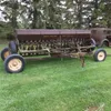 JD Van Brunt 24 run end wheel drill (trailer seen sitting on in pictures IS NOT INCLUDED)