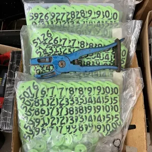 BOX OF LIVESTOCK TAGS & PLIERS