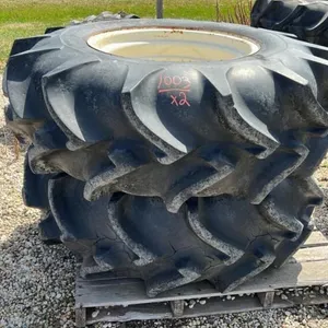 Used 18.4-26 imp tire on white 8 bolt rim
