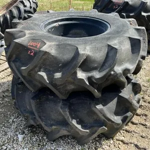 Used 18.4-26 imp tire on black 8 bolt rim