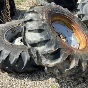 Used 14.9-24 imp tire on 8 bolt rim w/ fluid