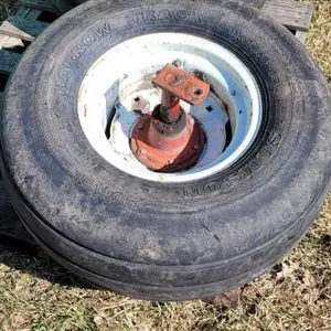 Used 31x13.5-15 tire on rim with stub axle
