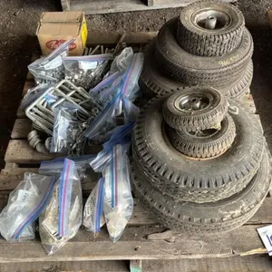 Pallet w/ asst’d cultivator shovel nuts and bolts, Asst’d nuts and bolts and nails, sieve bushings, (7) asst’d sized tires