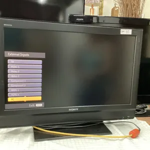 BRAVIA SONY 31" FLAT SCREEN TV W/ REMOTE ON STAND