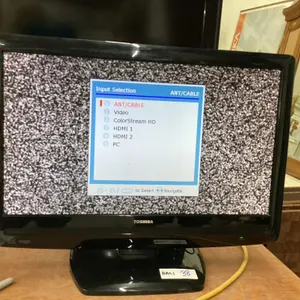 SMALL TOSHIBA 21" FLAT SCREEN TV W/ REMOTE ON STAND