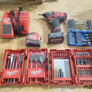 Milwaukee Drill, Battery, Charger, Tape Measure and Bits
 UNRESERVED