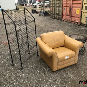 Leather Chair, Rolling Metal Shelf, Round Coffee Table
 UNRESERVED