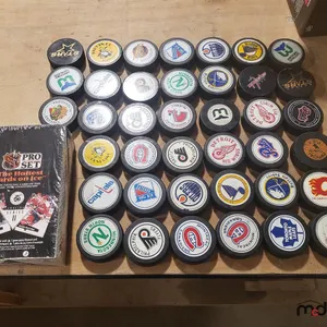 Hockey Pucks and Sealed Hockey Cards
 UNRESERVED