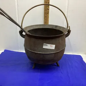 CAST POT W/LEGS. 10 IN TALL. 12 IN ACROSS