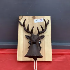 CAST DEER HEAD W/ BELL MOUNTED ON WOOD SLAB