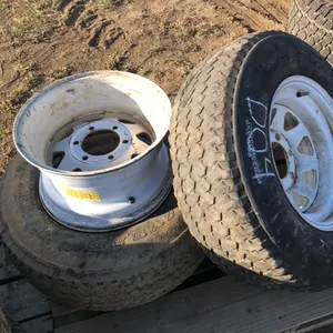 (4) 15 inch six bolt trailer rims 2 with tires