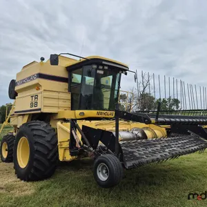1997 New Holland TR98 Header w/ New Holland Header
 UNRESERVED