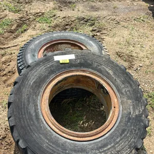 2 used tires on rims 10.00-20, 11.00-20 XR