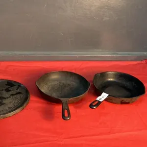 (3) CAST IRON PANS - (2) FRY PANS, (1) GRIDDLE