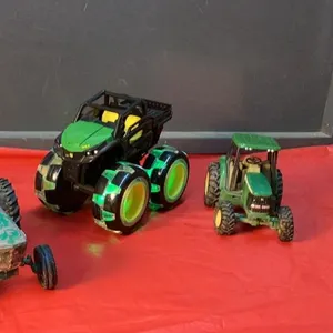(2) ERTL METAL/CAST TRACTORS  AND A JD ERTL PLASTIC MONSTER TRUCK- (2)