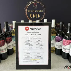 (1) Free Pizza a Month for a Year & (12) Bottles of Wine (Pizza Hut & Co-op Liquor)
 UNRESERVED
