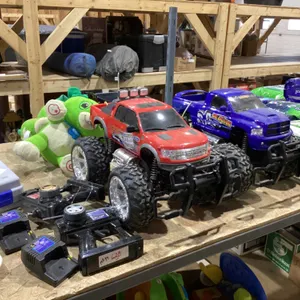 SHELF #4:  RC TRUCKS, EVIDENCE KIT, KIDS TALKING TOY