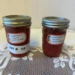 Two jars of crab apple sauce