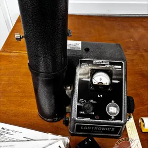 Labtronics 919 moisture meter with canola seed roll and .5 litre bushel weight container.