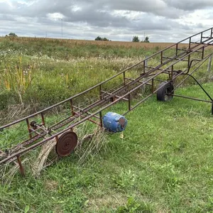 Bale elevator with electric motor