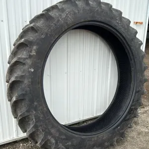 Used Firestone 320/90R46 tire (was damaged by crop divider but still held air)