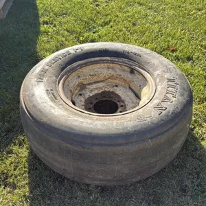 Used Titan 11L-15SL tire on 6-bolt rim