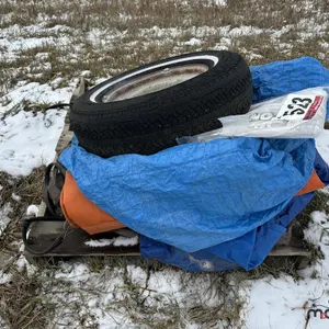 Pallet of Assorted Tarps & P225/75R15 Tire w/ Rim
 UNRESERVED