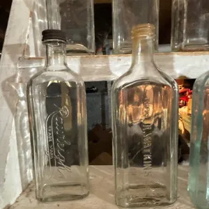 -collection of 12 various medicine bottles by Watkins Rawleigh's embossed glass medicine bottles  an