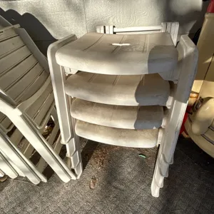 -set of eight plastic lawn chairs, and four stool/leg rest