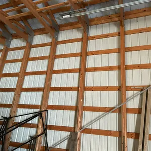 WOOD FRAMED POLE BUILDING - LAMINATED POSTS 60" x 100" W/2 OVERHEAD DOORS 14x14 -- (BUYER MUST HAVE BUILDING REMOVED BY JULY 30, 2026)  BY BIDDING ON 