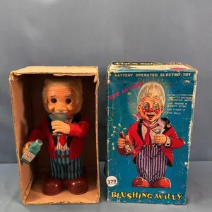 TIN BATTERY OPERATED BLUSHING WILLY TOY