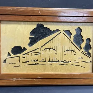 Handcrafted wooden scrolled wall hanging of a