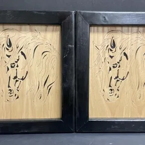 Handcrafted pair of wooden scrolled wall hangings