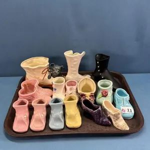 COLLECTION OF POTTERY SHOES, SLIPPERS & BOOTS