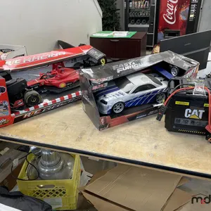CAT 1,200A Battery Booster, (2) Remote Control Cars
 UNRESERVED