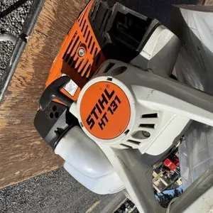 Stihl HT 131 gas powered pole saw. Working