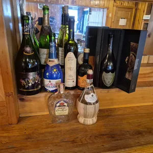(9) Assorted Decorative Bottles with Dom Perignon Bottle in Box