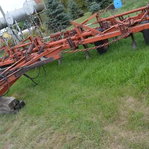 Co-op Deep Tiller, approx. 21', 3 row tine mulchers, 14" cultivator spikes (2 way), partial twist on left side of hitch frame, 3 good tires, 1 worn on