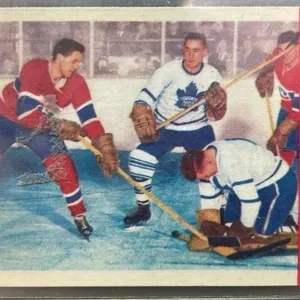 1955-56 Beliveau Bats At Loose Puck Card. *DC