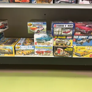 SHELF OF ASSORTED MODEL CARS INCLUDING; AMI 1964 BELVEDERE, AMI FORD F-100 CAMPER PICKUP, AMI 1970