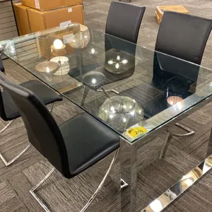 GLASS DINING TABLE WITH 4 CHAIRS. 71" X 35". GLASS TOP HAS SOME SCRATCHES.
