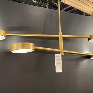 4 LIGHT CHANDELIER WITH SEEDED GLASS LENSES. AGED BRASS. 54" ACROSS