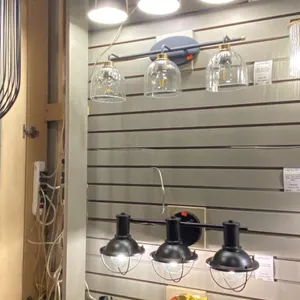 GROUP OF 4 X 3 LIGHT VANITY LIGHTS. RETAIL $1800