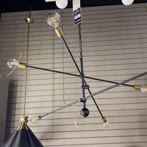 AXLE 6 LIGHT PENDANT. BLACK AND BRASS. 50" ACROSS