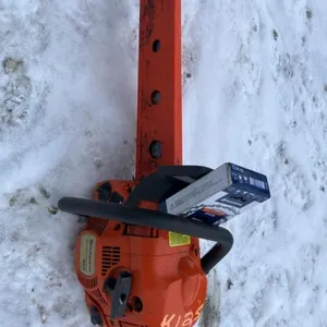 K125. Husqvarna 450 chain saw