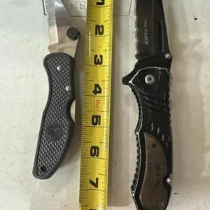1 black folding knife
1 tac force folding knife