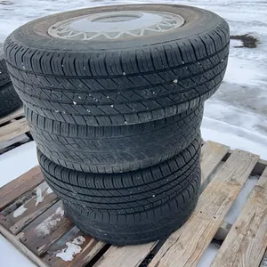 4 - 205/75R15 TIRES ON ALUMINUM RIMS - RIM VALUE ONLY